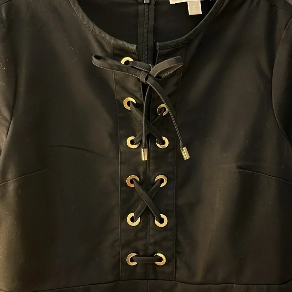 Michael Kors short sleeved black dress with lacing. Size 10.